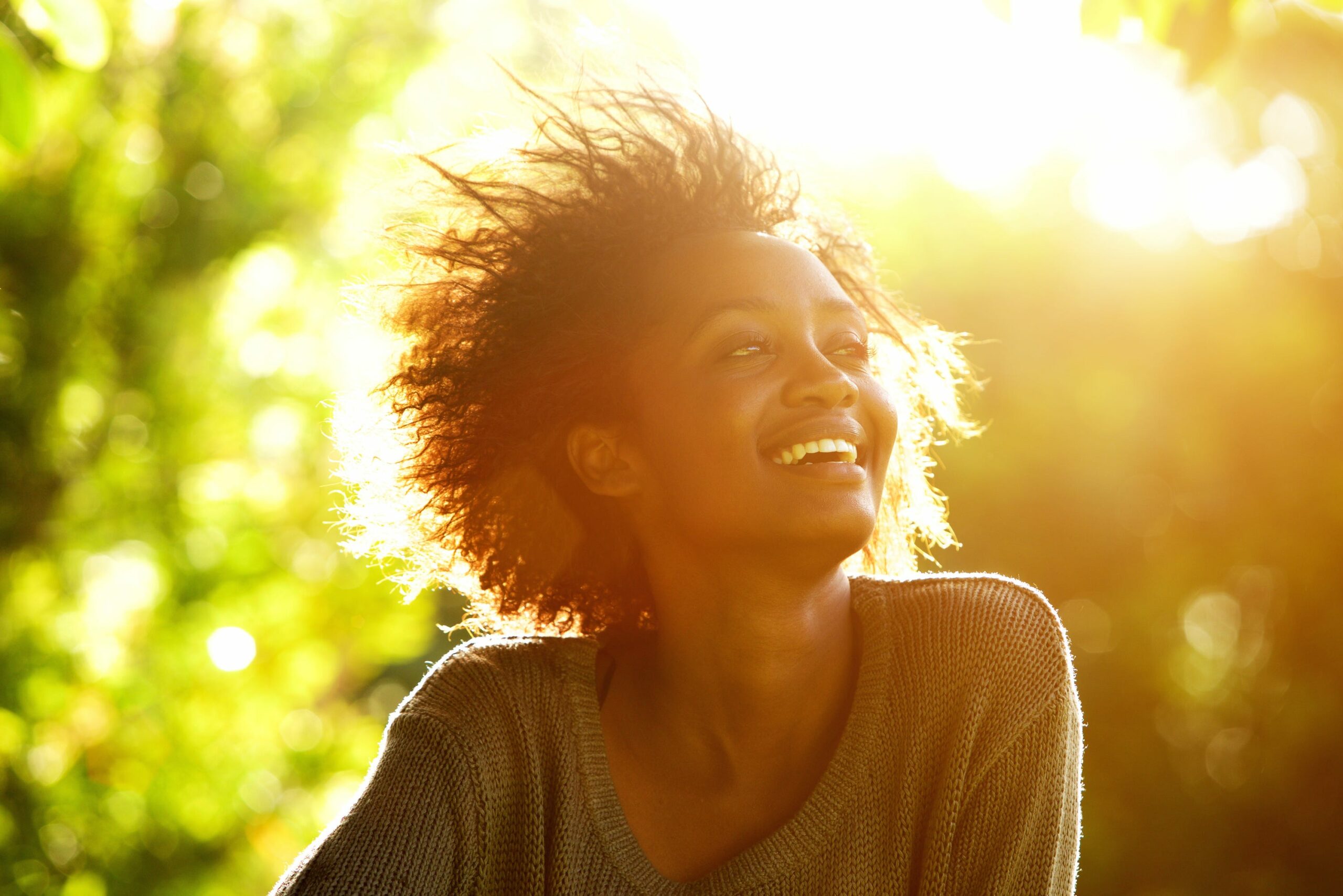 woman smiles in sunshine scaled