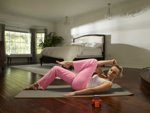 woman worksout in bedroom