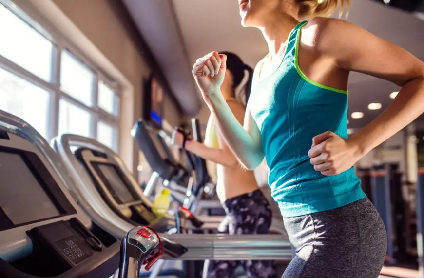 women run on treadmill