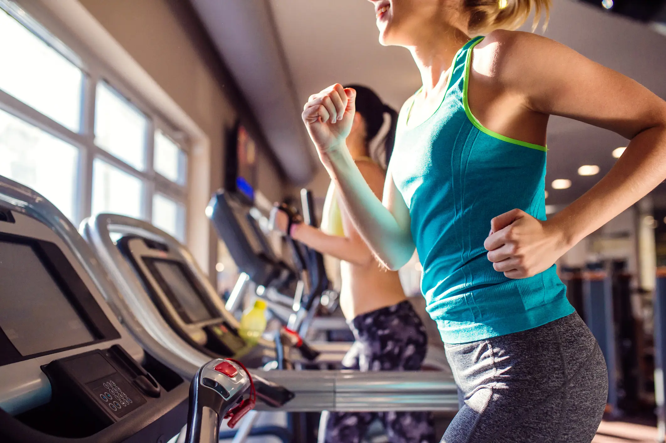 Women run on treadmill