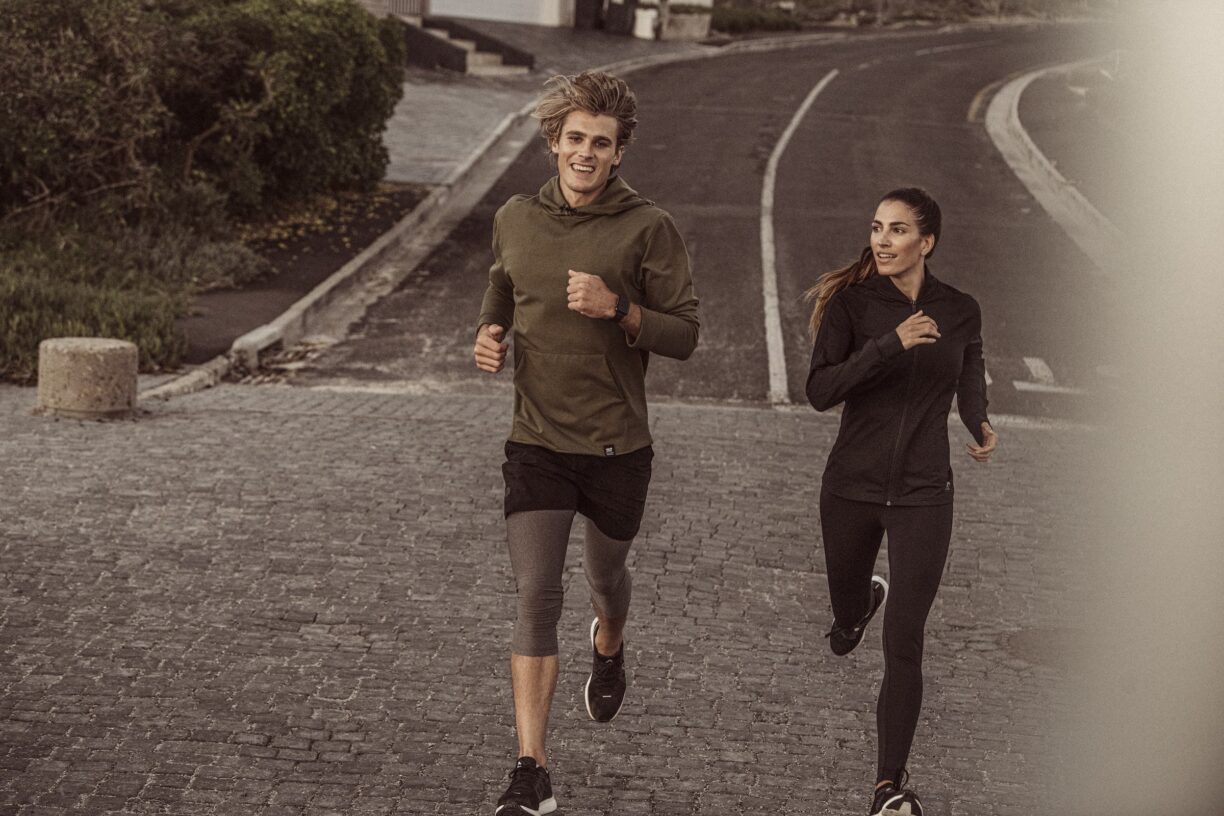 couple running on road