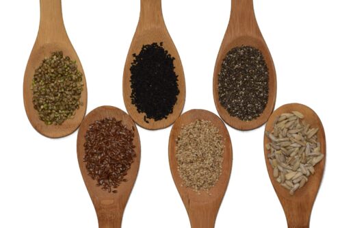 mixture of seeds on spoons
