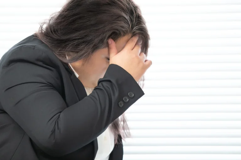 overweight woman covers face scaled