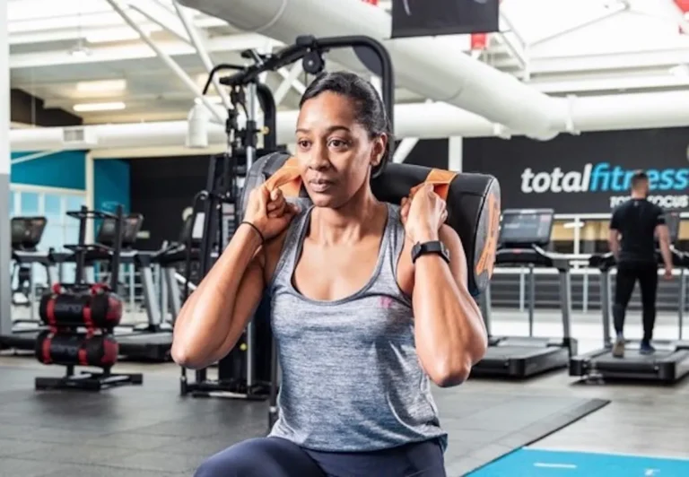 woman exercises at total fitness gym