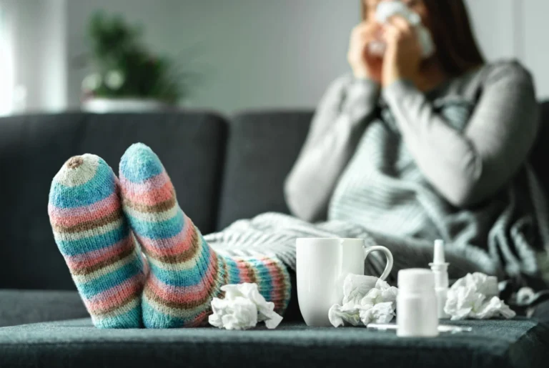 woman sits with tissues surrounding her