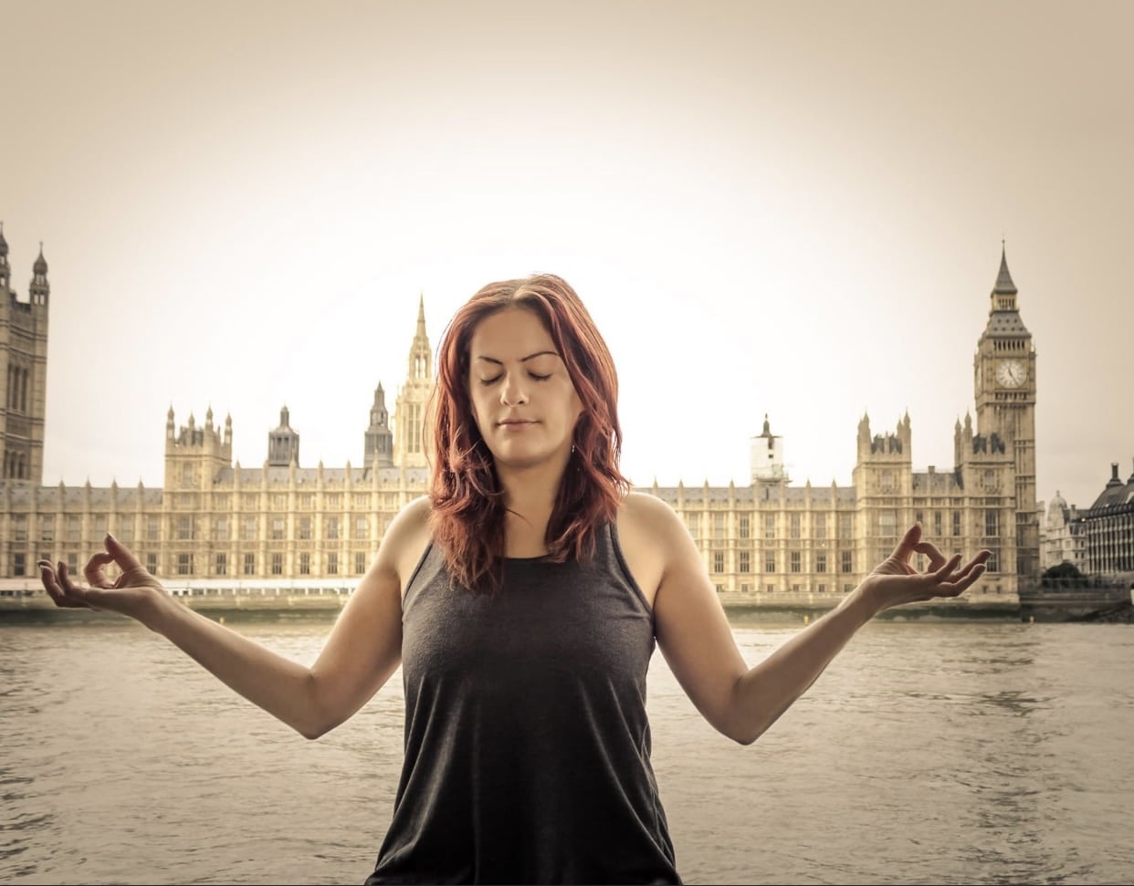 yogi practicing yoga outside westminster