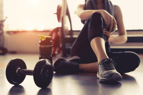 fitness person sits on floor