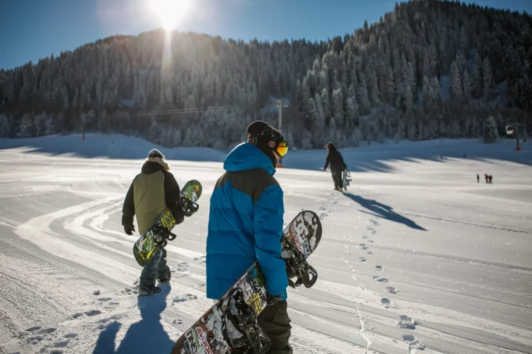snowboarders prepare to hit the slopes scaled