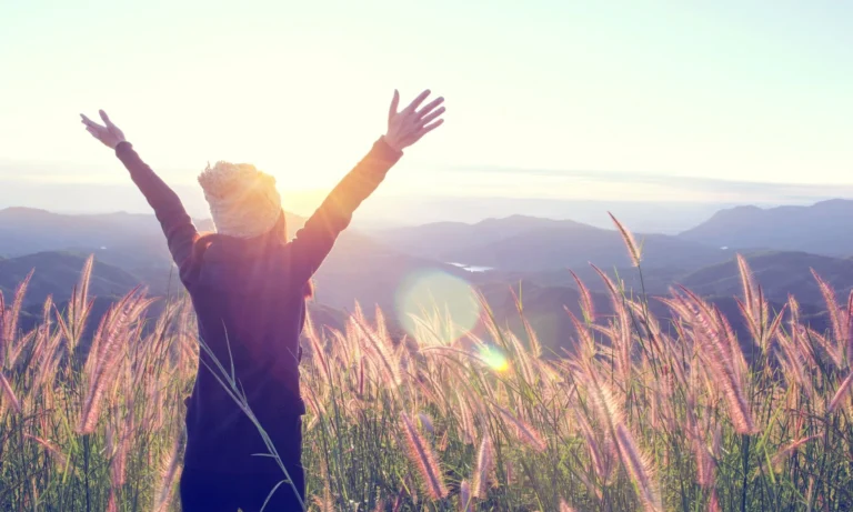 woman gazes into sunlight scaled