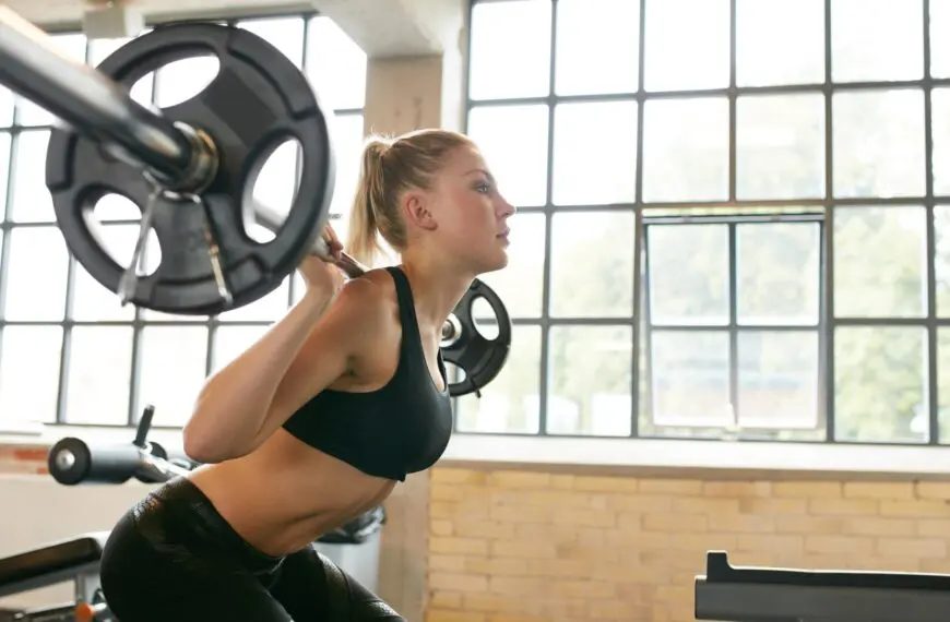 woman squats with weights