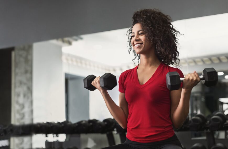woman working dumbbells scaled