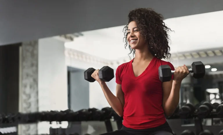woman working dumbbells scaled
