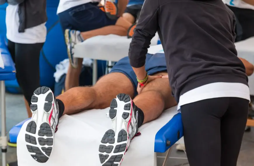 athlete gets leg massage scaled