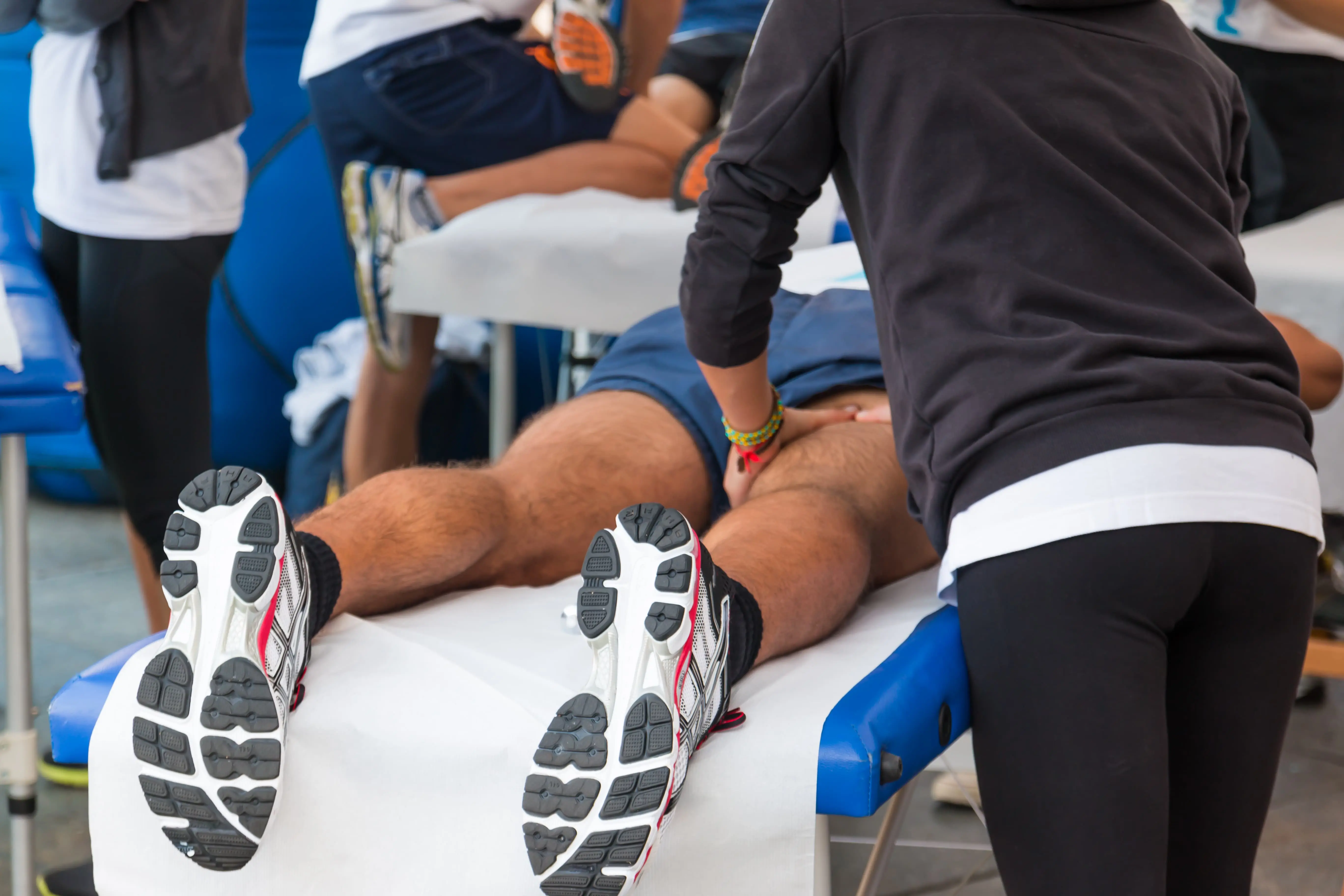 Athlete gets leg massage scaled