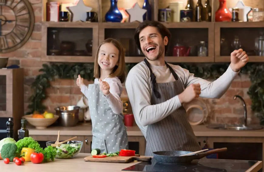 chef and child dance in kitchen scaled