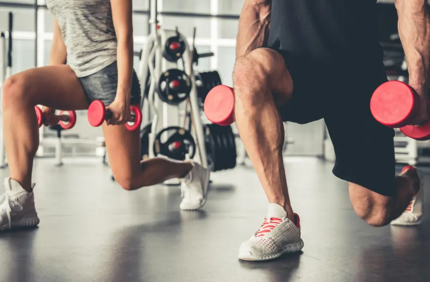 couple training with dumbells
