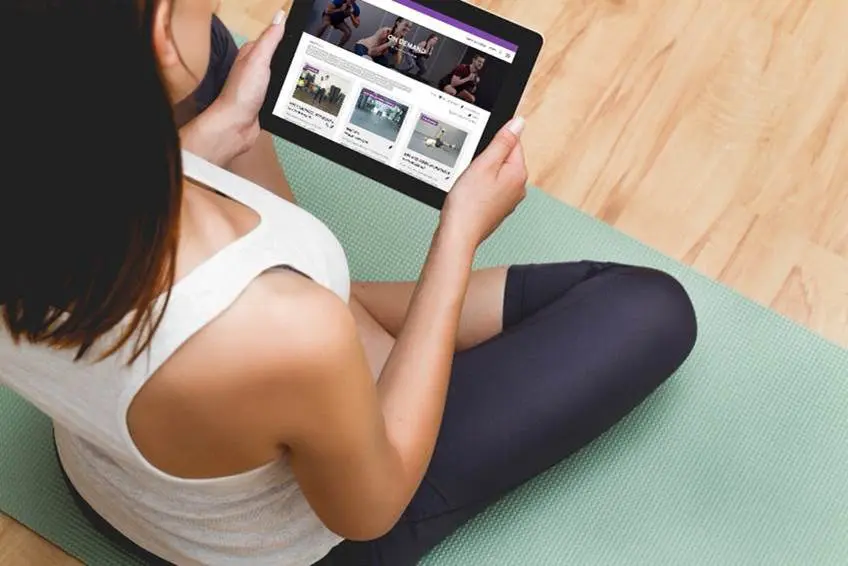 woman checks out AF on tablet