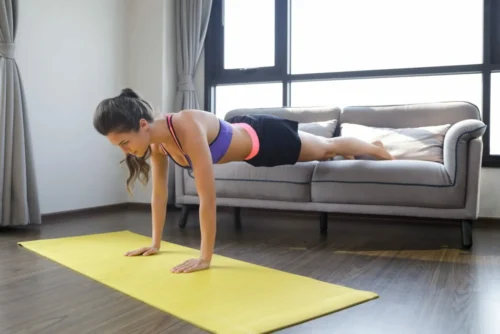 woman planks from sofa scaled e1613647167320