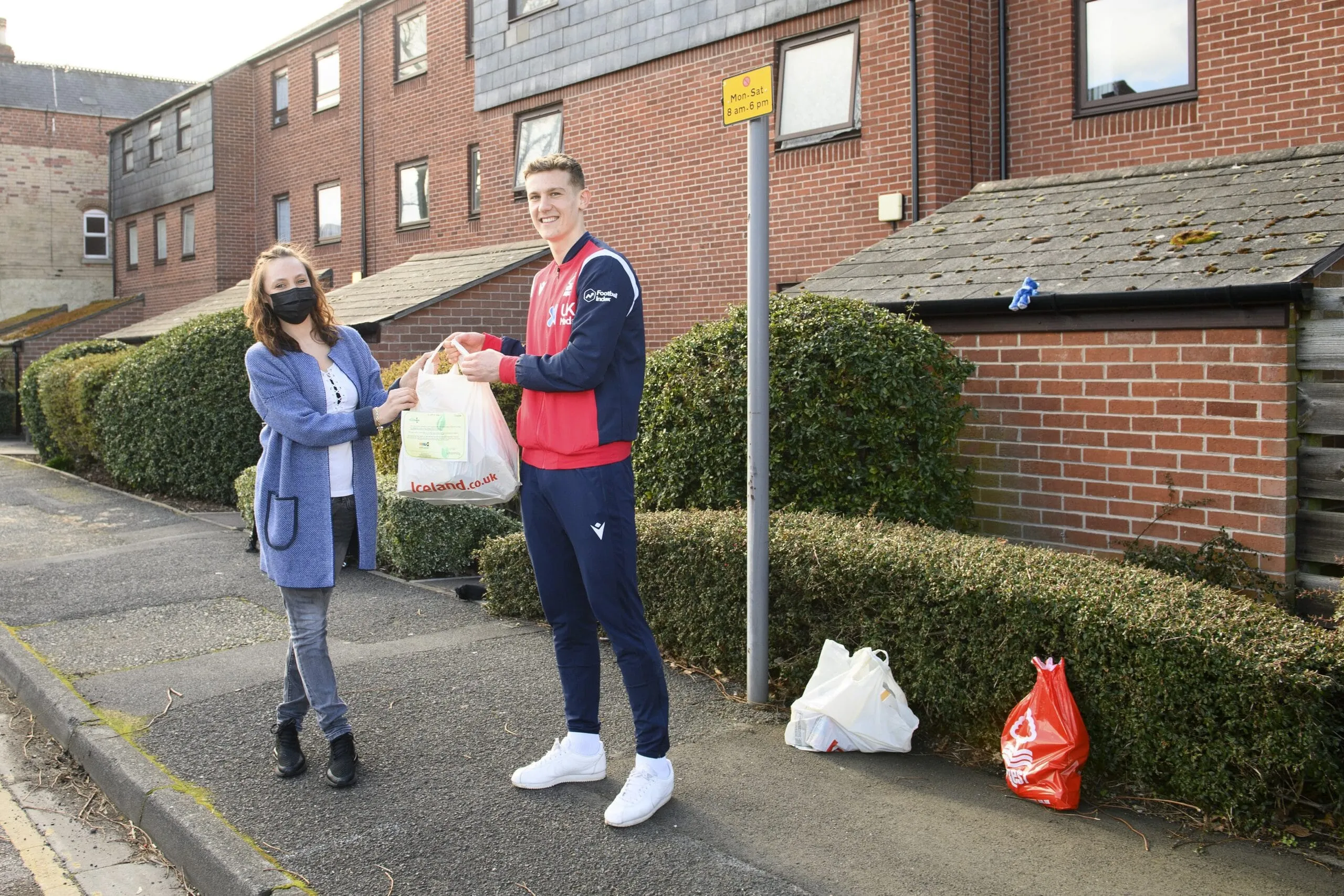 Nottingham Forests Ryan Yates gives food parcel to local resident. This is the one millionth food parcel delivered by EFL Clubs scaled