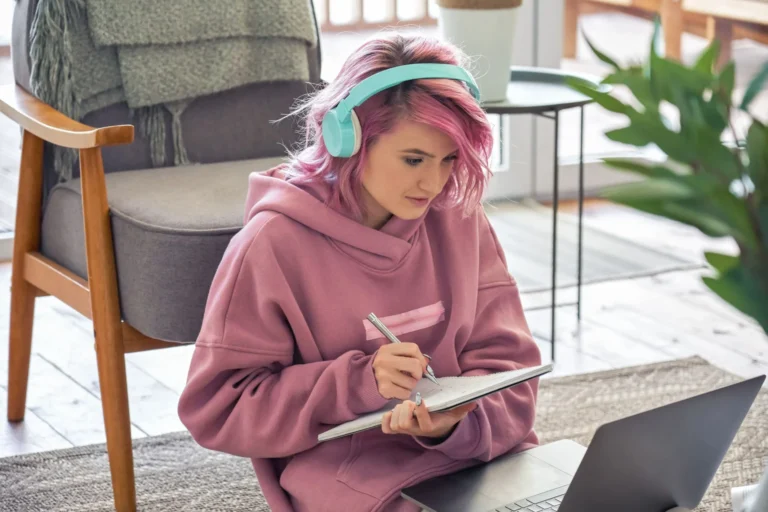 student with pink hair scaled