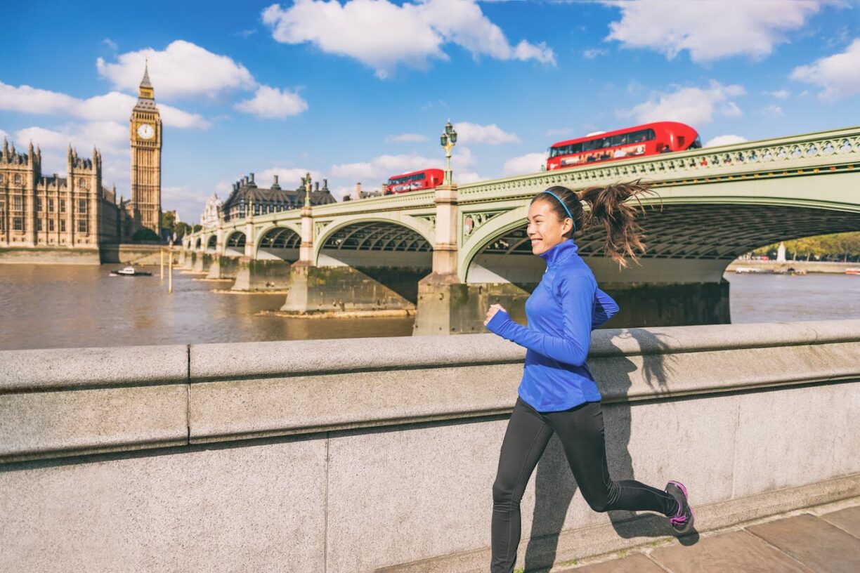 woman runs past westminster