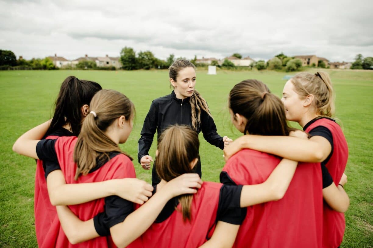 girls in sports huddle