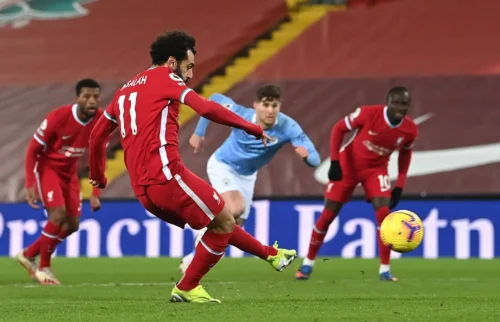 mo salah shoots towards goal against manchester city