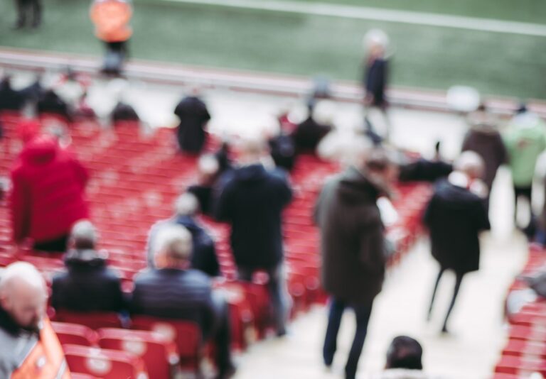 sports fans gather for the match