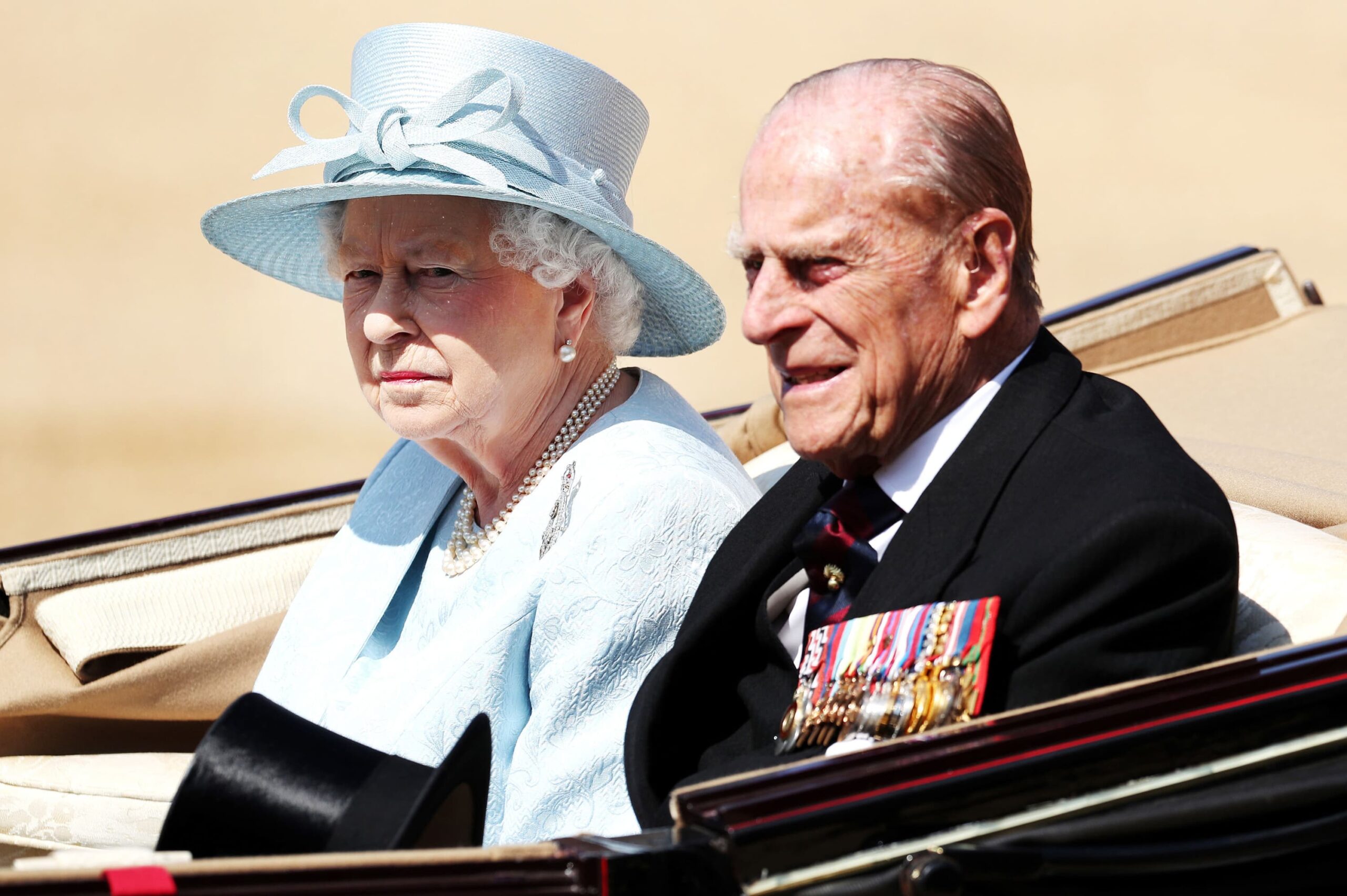 The queen of england with the duke of edinburgh scaled