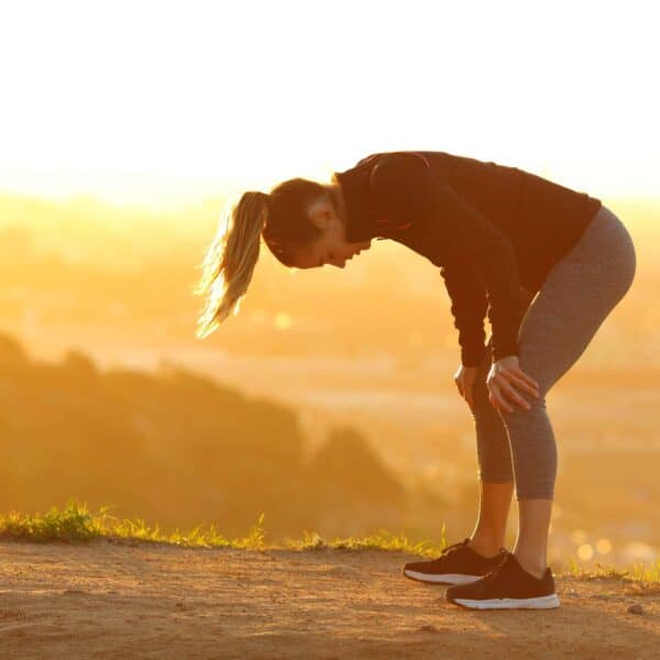 woman out of breath whilst exercising scaled