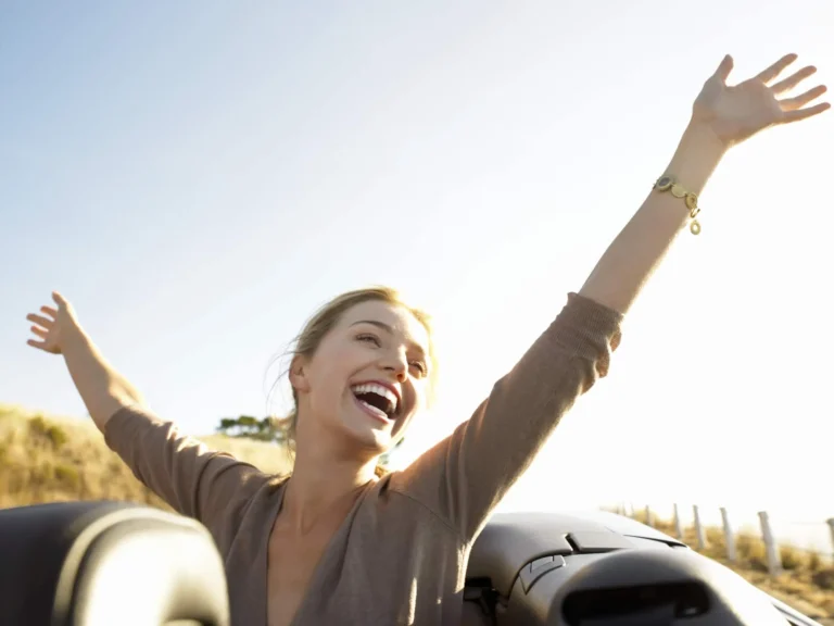 woman raising hand in happiness