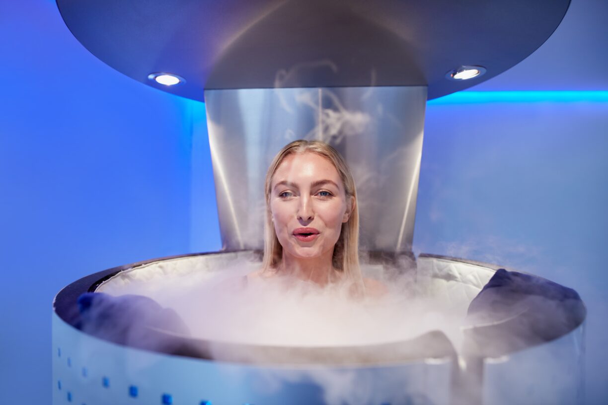 woman enters cryotherapy chamber