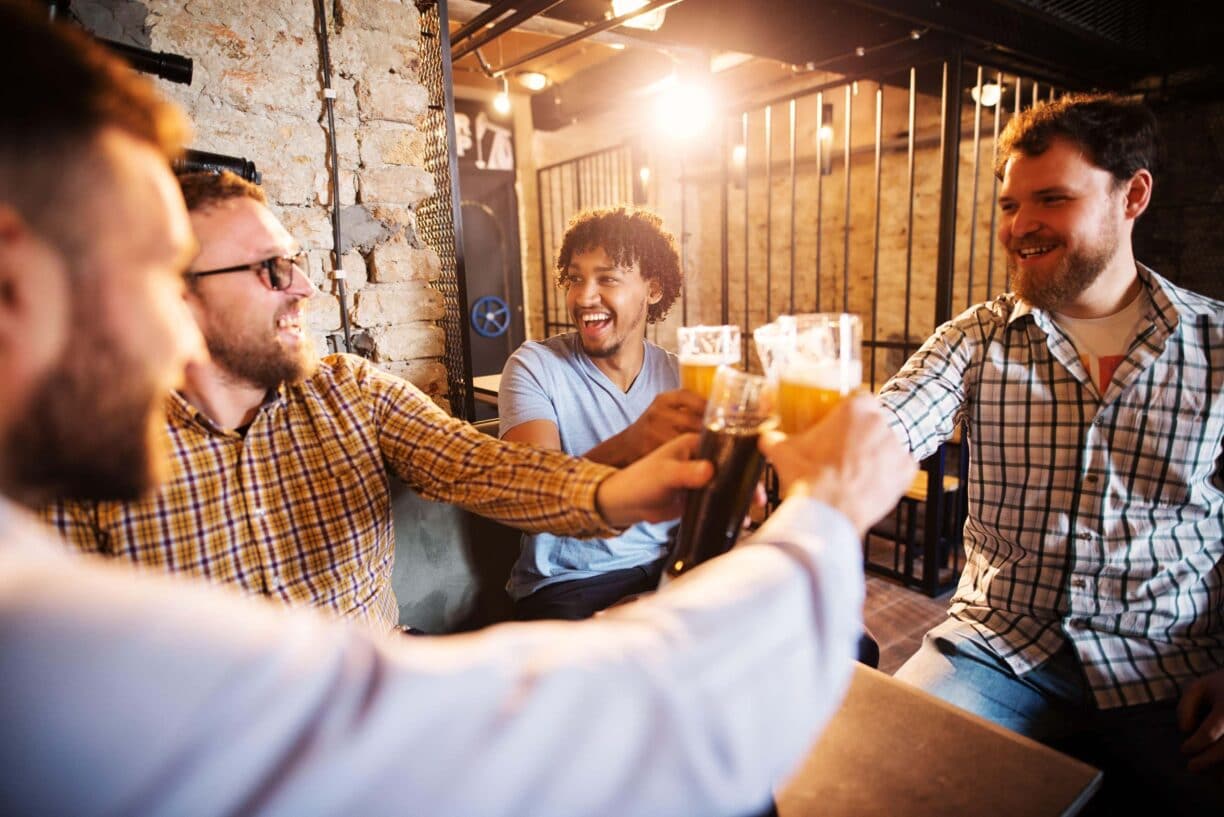 men gather together in a pub