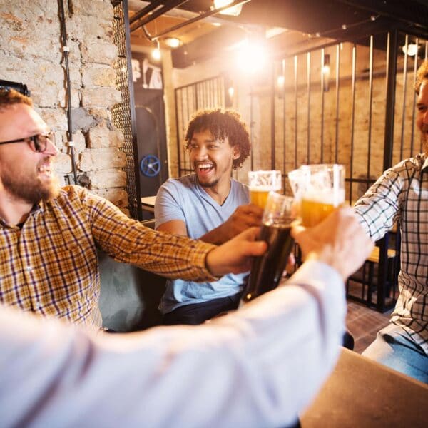 men gather together in a pub