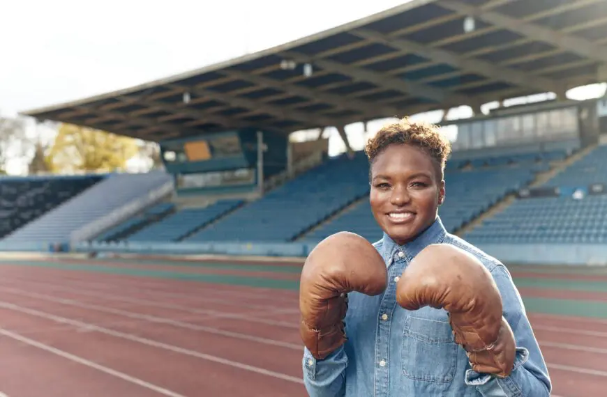 nicola adams track side with boxing gloves on scaled