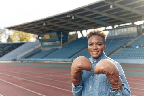 nicola adams track side with boxing gloves on scaled