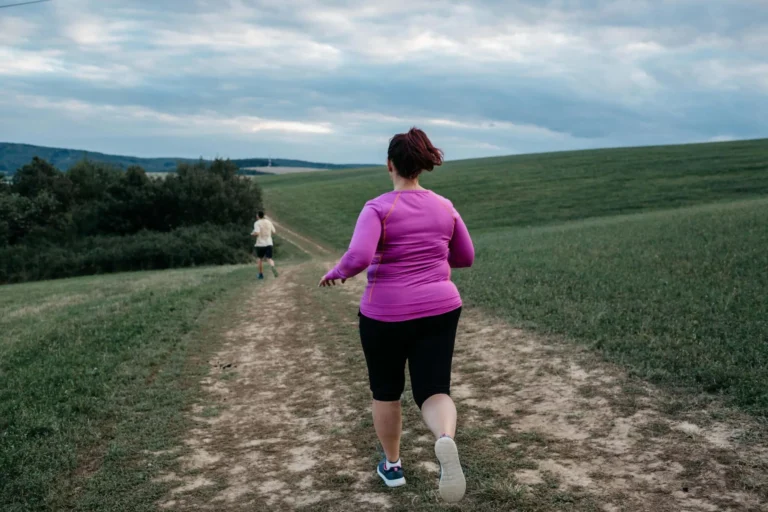 woman running on muddy path