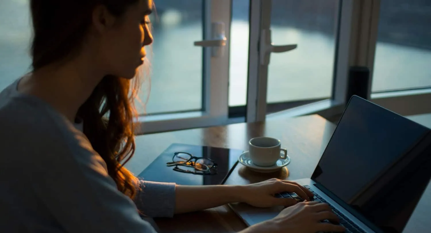 woman works at laptop e1644667409701