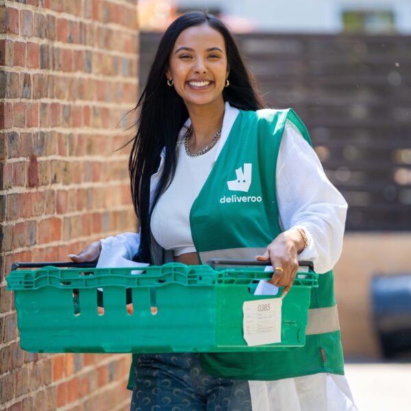 TV star Maya Jama surprises youths in Hackney East London to volunteer as part of Deliveroos Full Life campaign delivering 1m meals to people in the local communities scaled