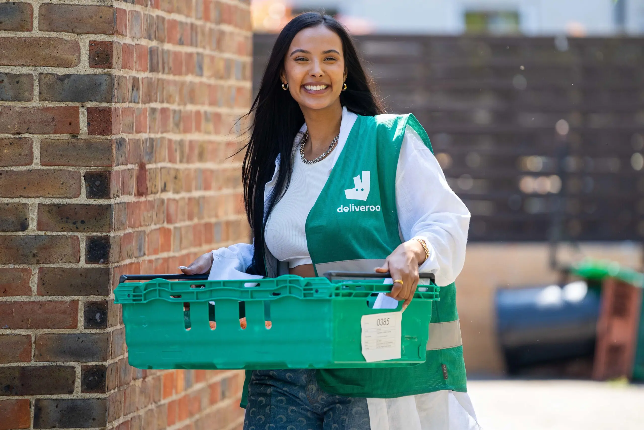 Tv star maya jama surprises youths in hackney east london to volunteer as part of deliveroos full life campaign delivering 1m meals to people in the local communities scaled
