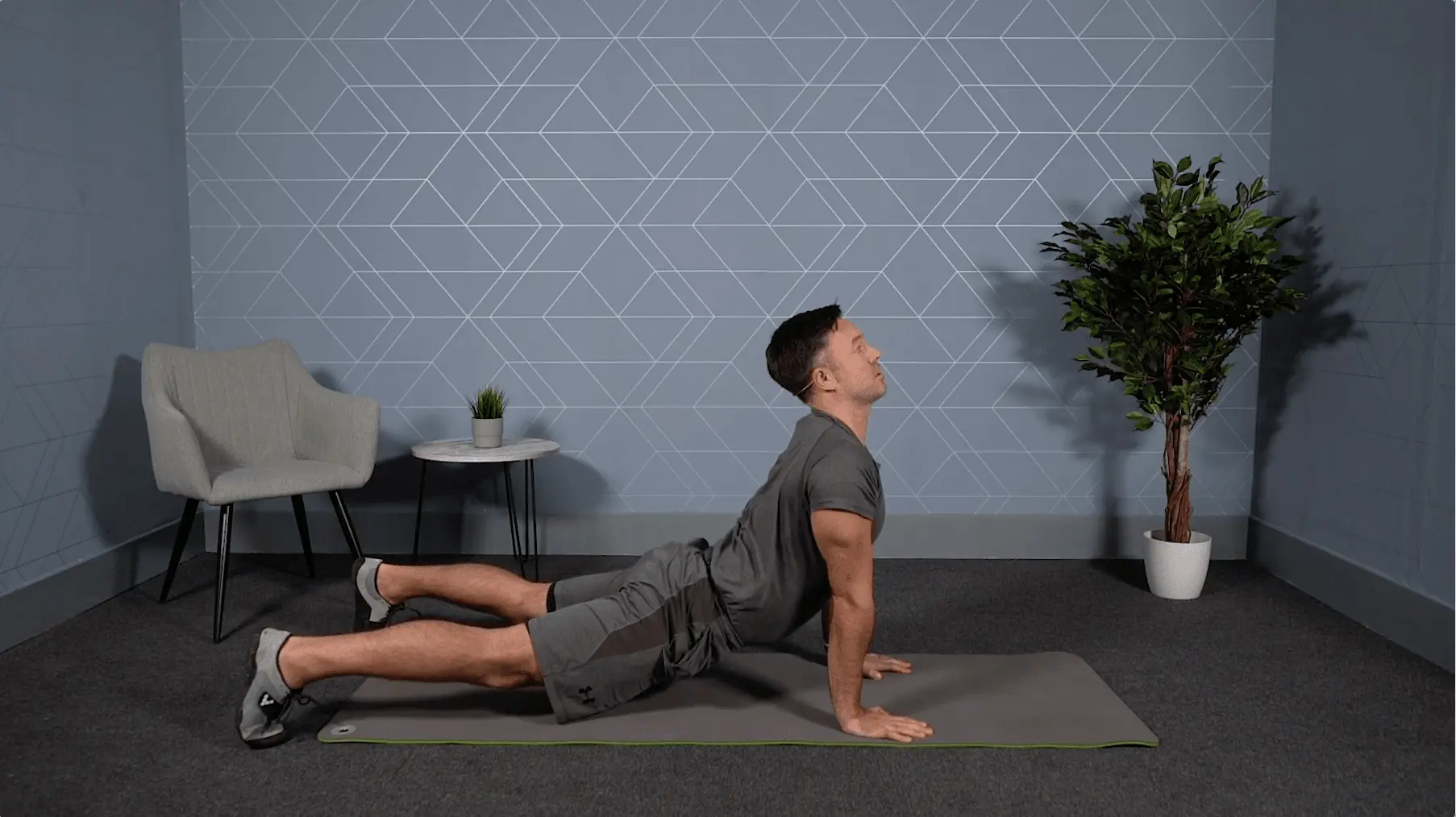 Fit man holds yoga position