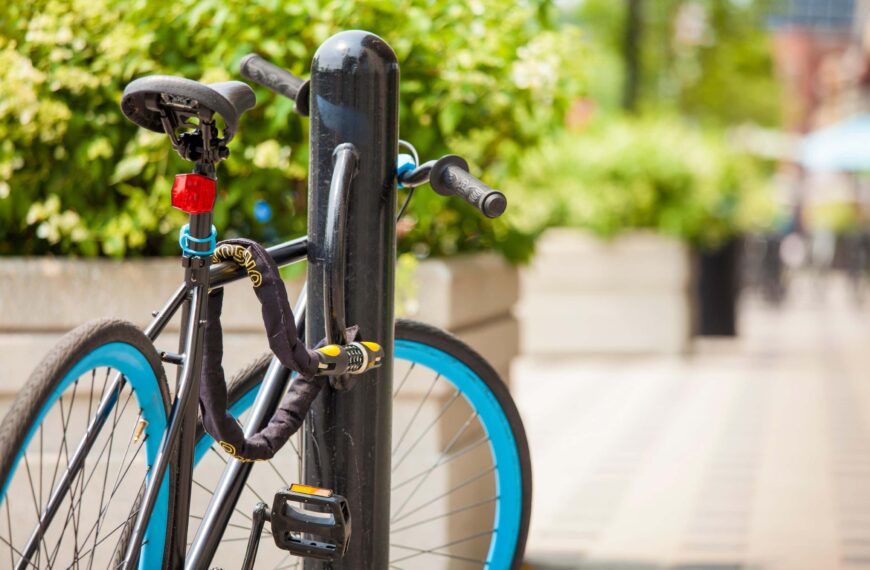 bike padlocked to fence scaled