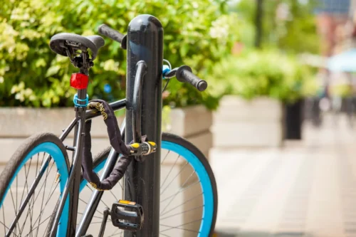 bike padlocked to fence scaled