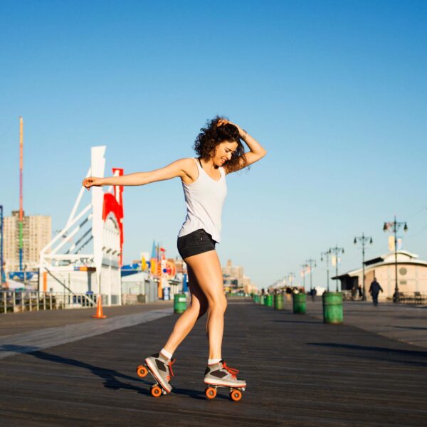 girl rollerskates on pathway scaled