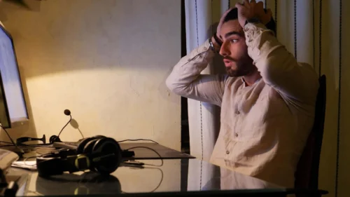 man holds head in despair scaled