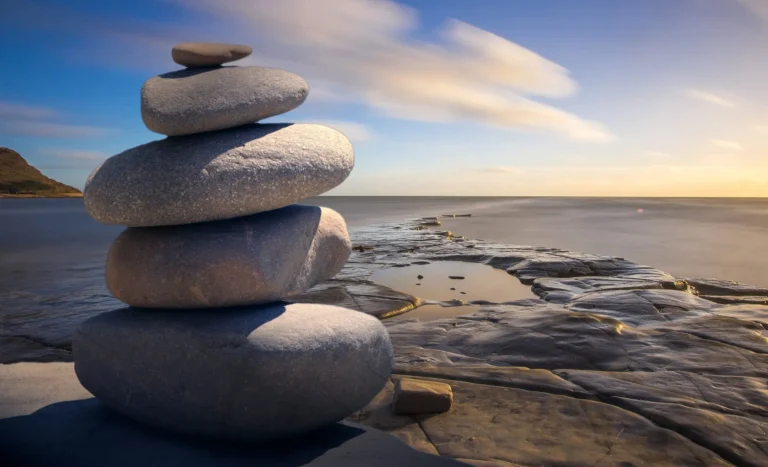 stones stacked on a beach scaled