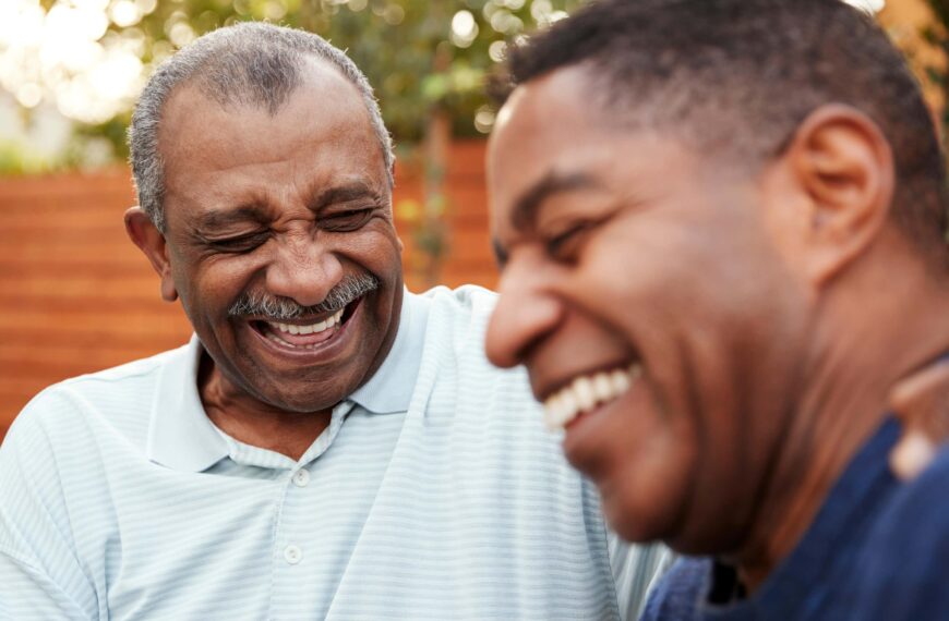 two men share a joke scaled