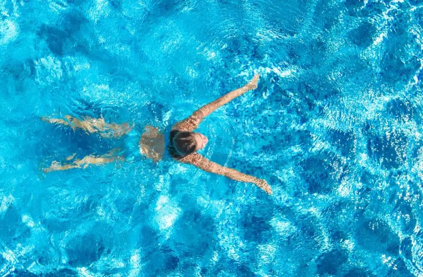 woman swims in pool