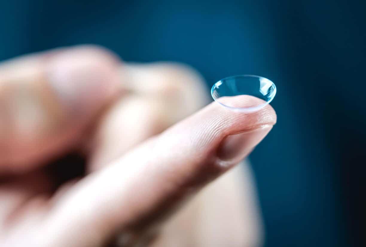 contact lense on finger