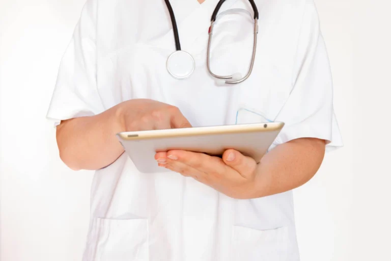doctor holding clip board scaled